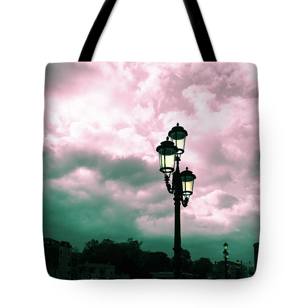 Toned Tote Bag featuring the photograph Winter Venice lantern on the embankment by Marina Usmanskaya