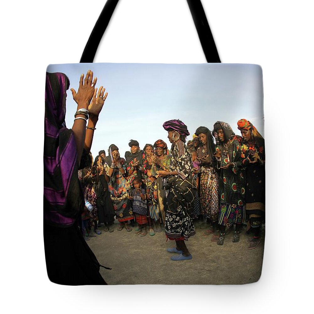 Mid Adult Women Tote Bag featuring the photograph Wodaabe Women Dancing In A Circle by Timothy Allen