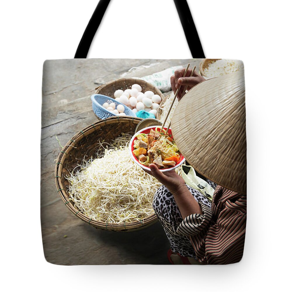 Three Quarter Length Tote Bag featuring the photograph Woman Eating Noodles With Baskets Of by Eternity In An Instant