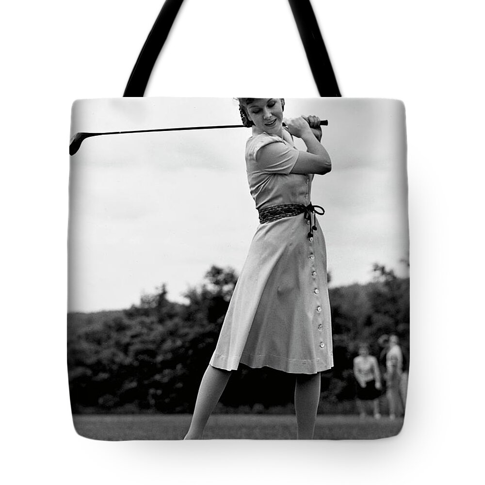 People Tote Bag featuring the photograph Woman Golfing by George Marks