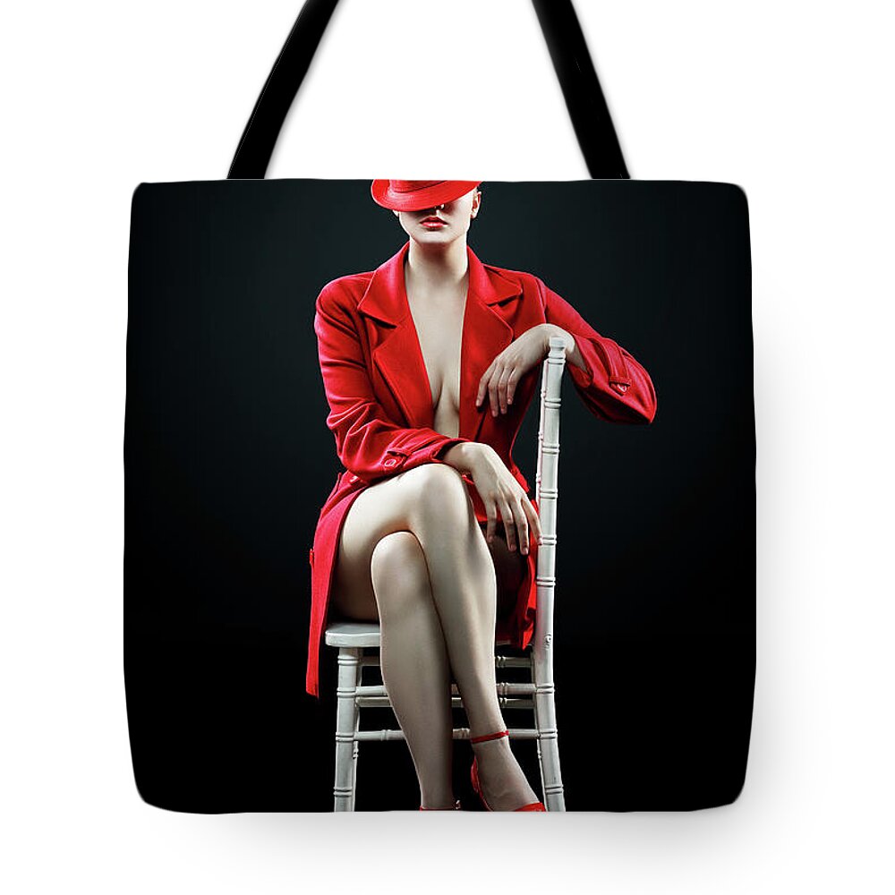 Woman Tote Bag featuring the photograph Woman in red by Johan Swanepoel