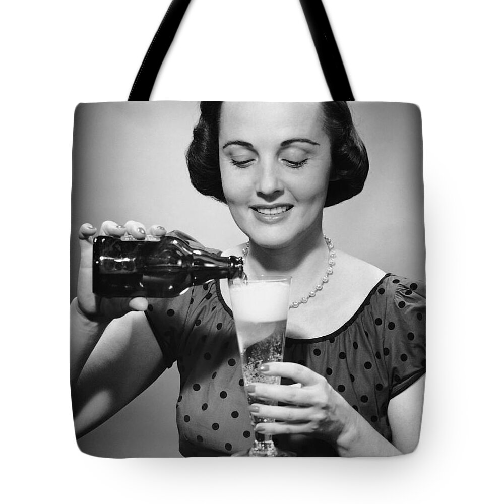 People Tote Bag featuring the photograph Woman Pouring Alcoholic Beverage by George Marks