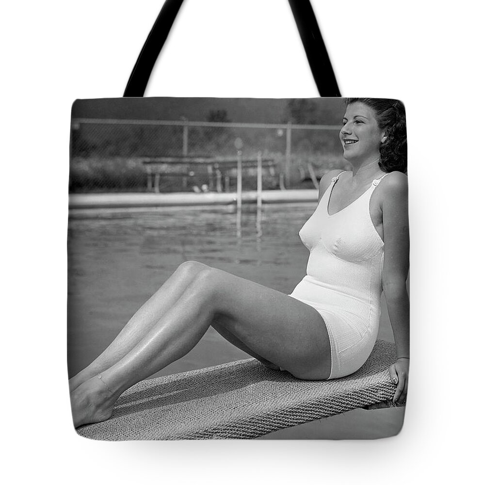 People Tote Bag featuring the photograph Woman Sitting On Divingboard by George Marks