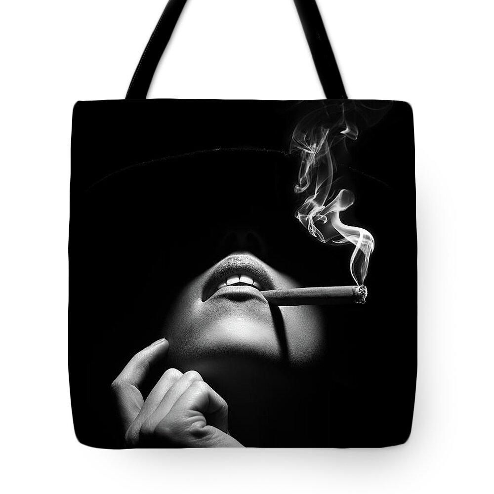 Woman Tote Bag featuring the photograph Woman smoking a cigar by Johan Swanepoel