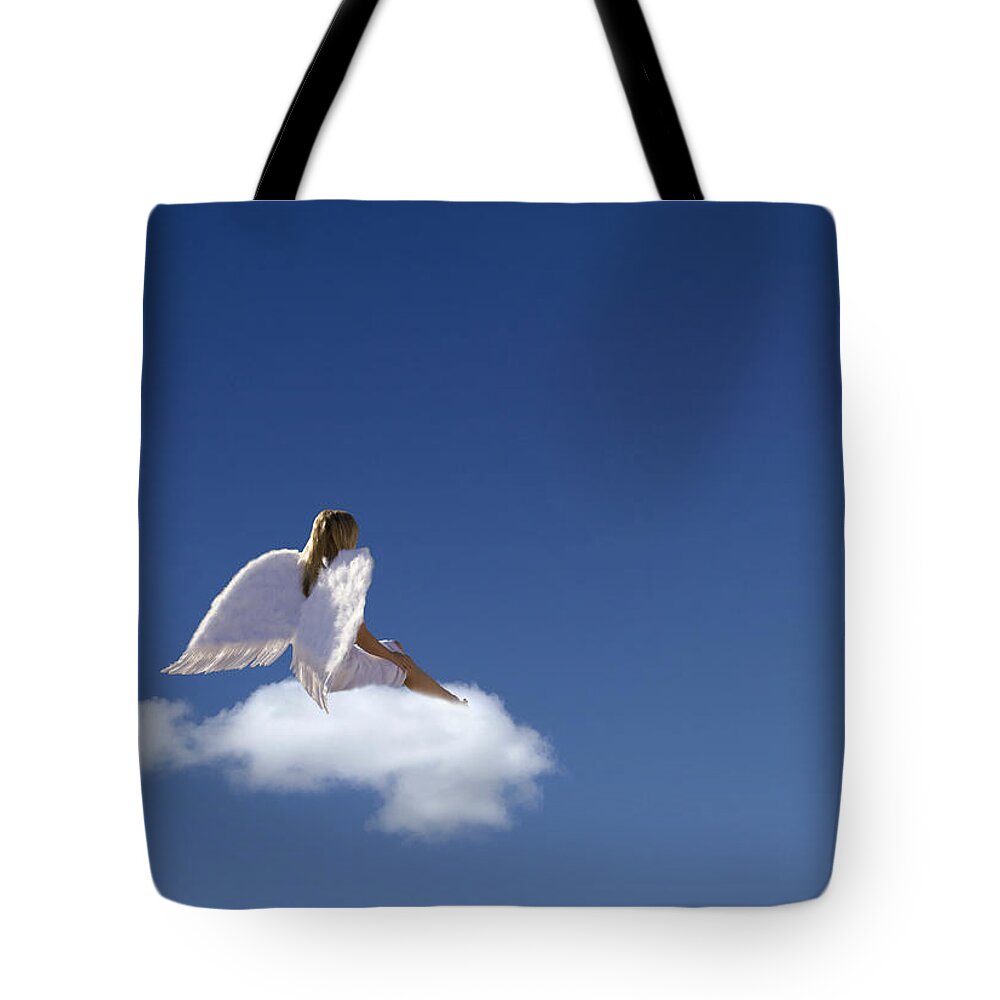 People Tote Bag featuring the photograph Woman With Angels Wings Sitting On by Buena Vista Images