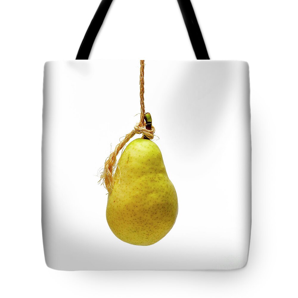Studio Shot Tote Bag featuring the photograph Yellow pear on a white background by Bernard Jaubert