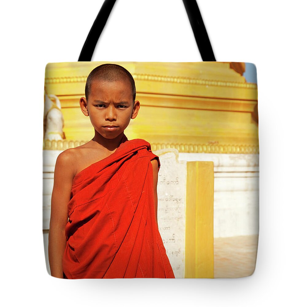Pagoda Tote Bag featuring the photograph Young Burmese Monk In Myanmar by Danielbendjy