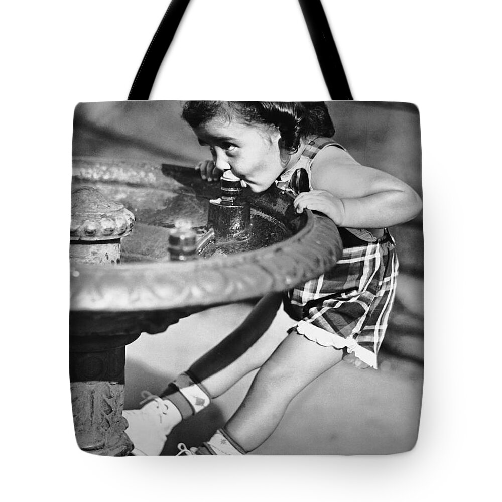 Child Tote Bag featuring the photograph Young Girl Drinking From Water Fountain by George Marks