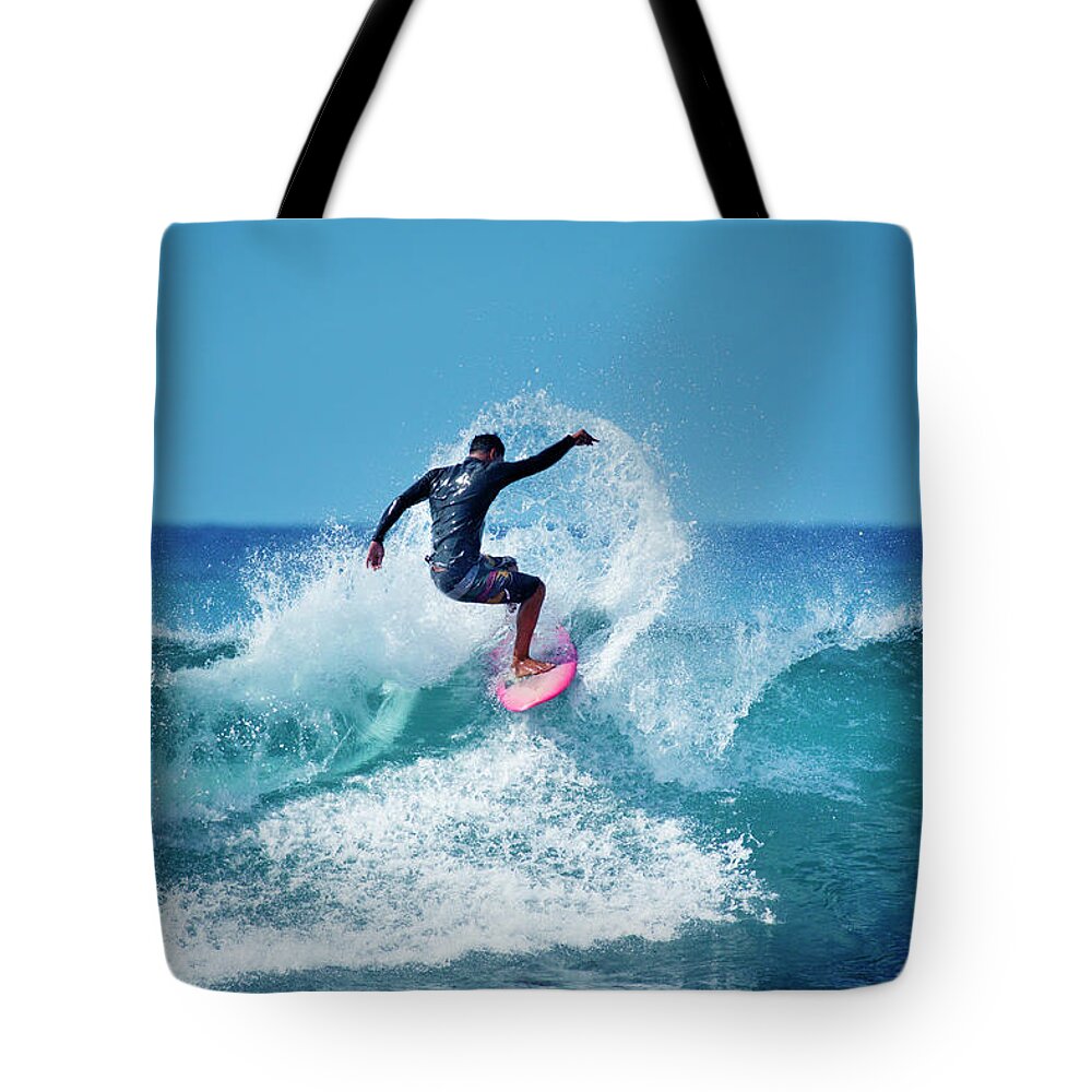 Young Men Tote Bag featuring the photograph Young Male Surfer Surfing In The Water by Yinyang
