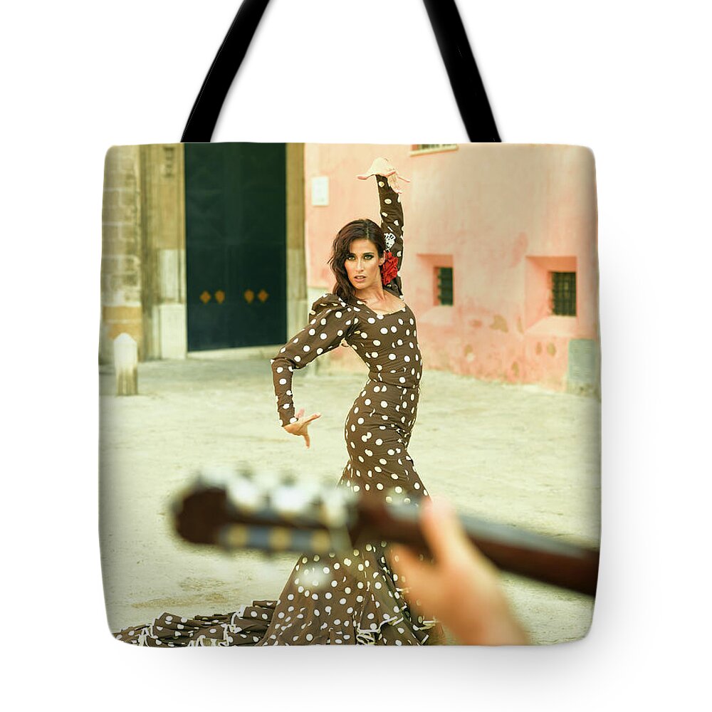 Hand Raised Tote Bag featuring the photograph Young Woman Dancing by Denkou Images