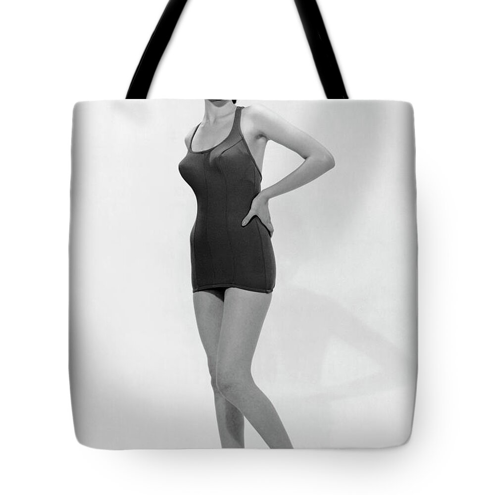People Tote Bag featuring the photograph Young Woman Poses In Bathing Suit by George Marks