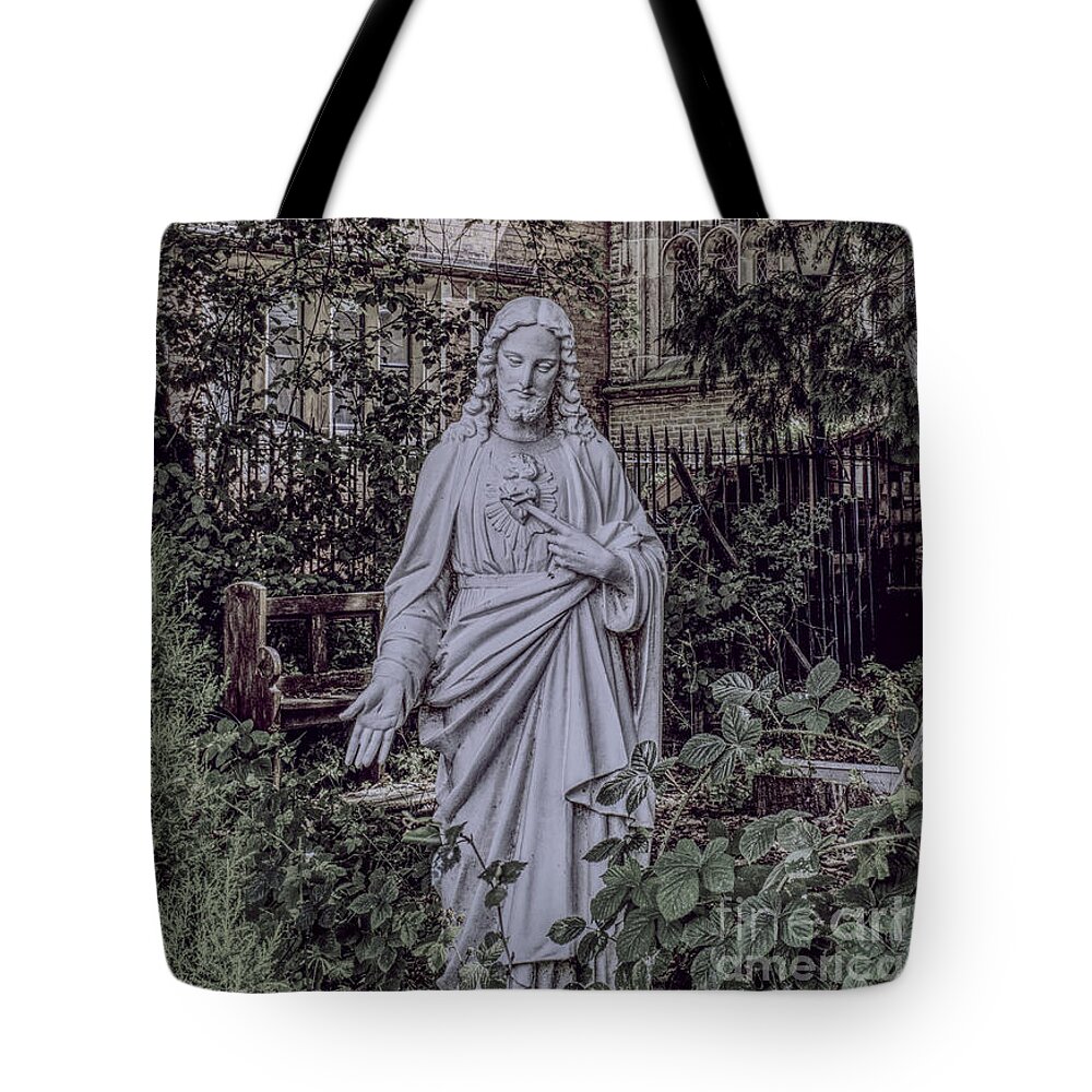 Statue Tote Bag featuring the photograph A statue of Christ in The Church of the Holy Name of Jesus, Oxford Road, Manchester, England. by Pics By Tony