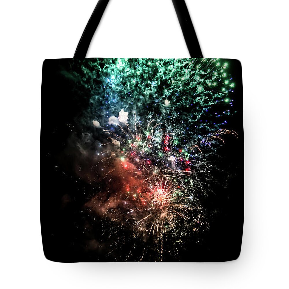 Fireworks Tote Bag featuring the photograph Celebration With Bright Colorful Fireworks Over Black Sky #1 by Andreas Berthold