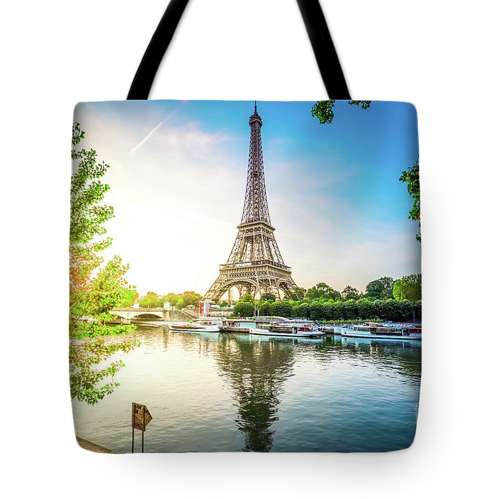 Eiffel Tote Bag featuring the photograph Eiffel Tour over Seine river #1 by Anastasy Yarmolovich