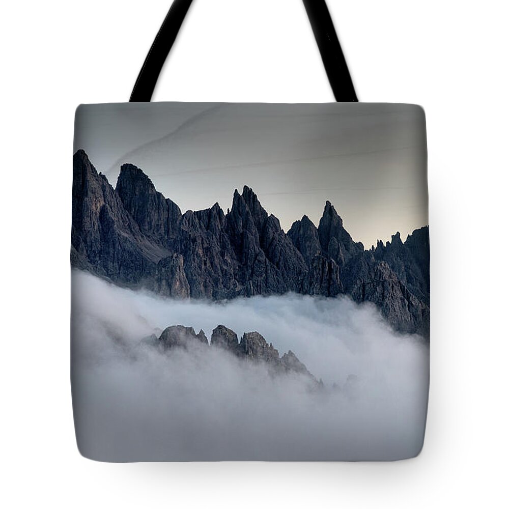 Dolomiti Tote Bag featuring the photograph Mountain landscape with mist, at sunset Dolomites at Tre Cime Italy. by Michalakis Ppalis