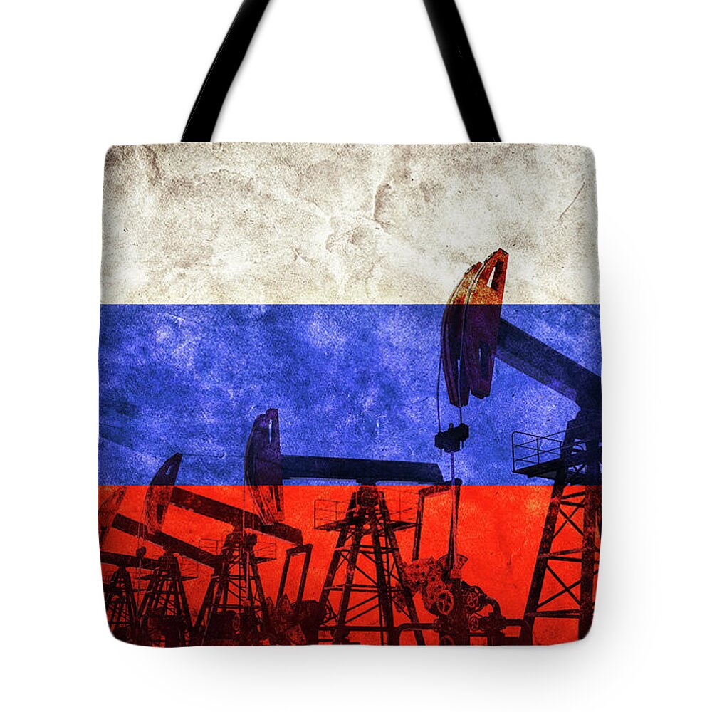Oil Tote Bag featuring the photograph Oil pump jack on flag of Russia. Russian petroleum #1 by Michal Bednarek