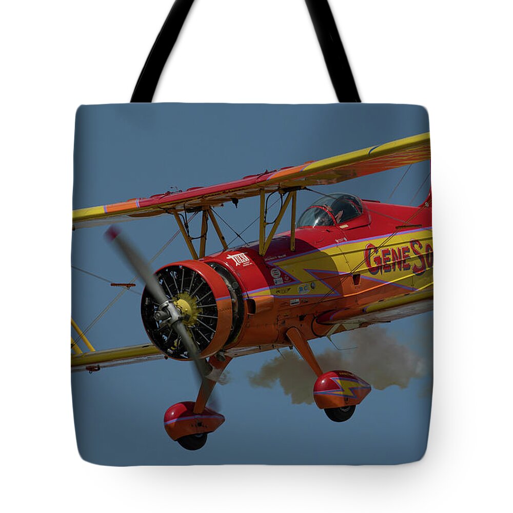 Red Tote Bag featuring the photograph Red and Yellow Airplane by Carolyn Hutchins