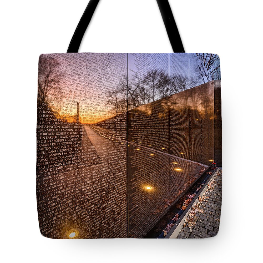Sunrise Tote Bag featuring the photograph Sunrise reflections at the Vietnam Veterans Memorial by Robert Miller