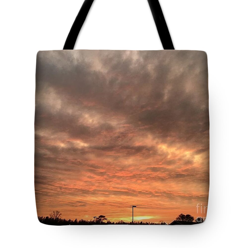 Sunset Tote Bag featuring the photograph Smokey Sunset by Catherine Wilson