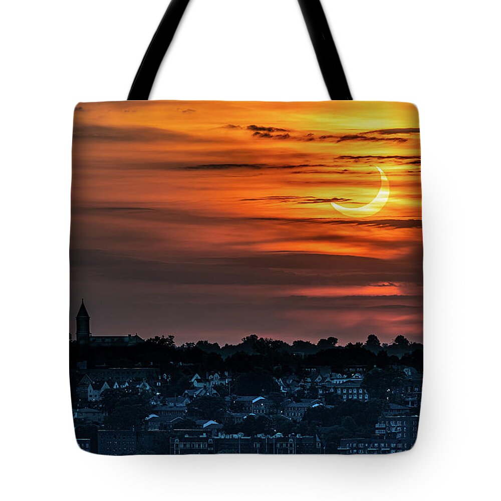 New York Tote Bag featuring the photograph Solar eclipse over Yonkers by Kevin Suttlehan