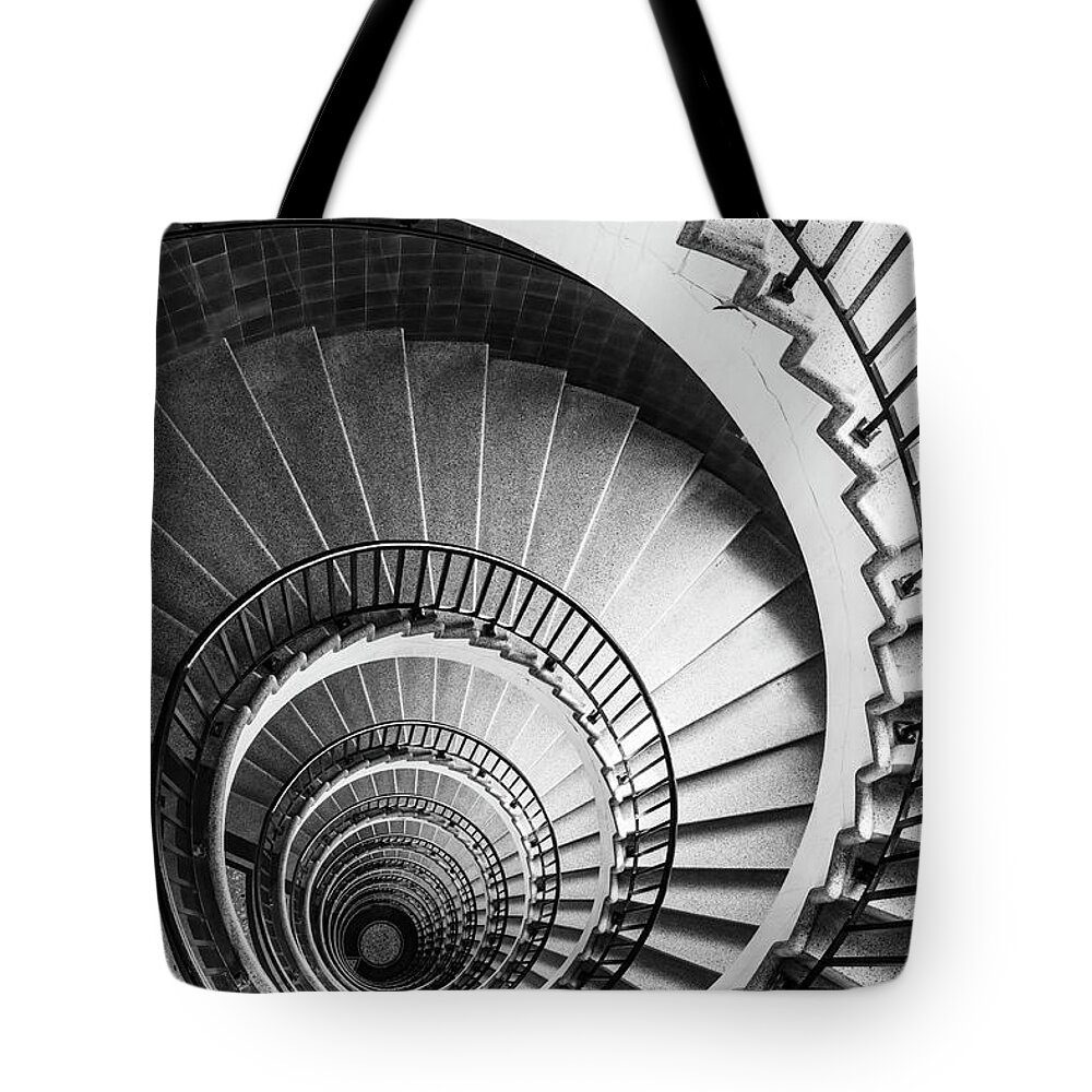 Spiral Staircase Tote Bag featuring the photograph Spiral staircase in The Neboticnik, Ljubljana, Slovenia #1 by Neale And Judith Clark