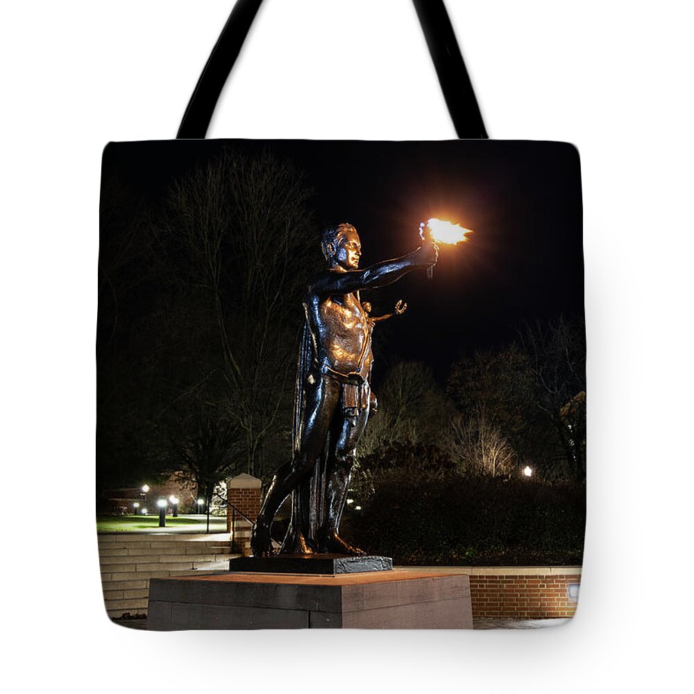 University Of Tennessee At Night Tote Bag featuring the photograph Torchbearer statue at the University of Tennessee at night by Eldon McGraw