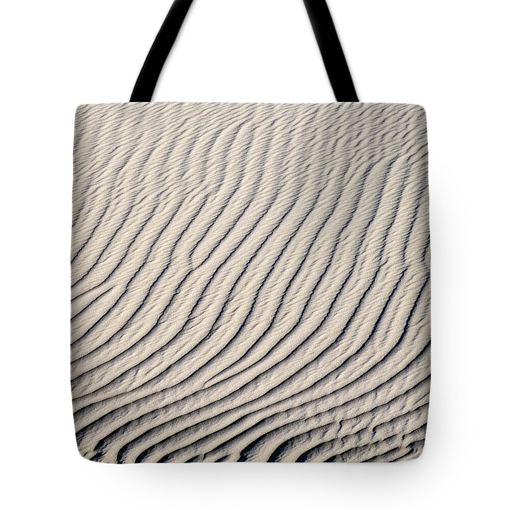Sand Tote Bag featuring the photograph Background of sand dunes by Mikhail Kokhanchikov