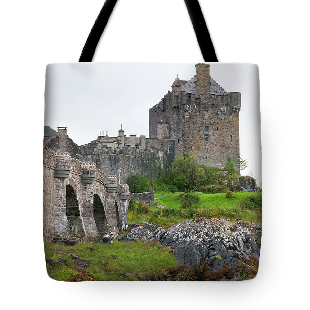Scotland Tote Bag featuring the photograph Eilean Donan Castle in the loch Alsh at the highlands of Scotlan by Michalakis Ppalis