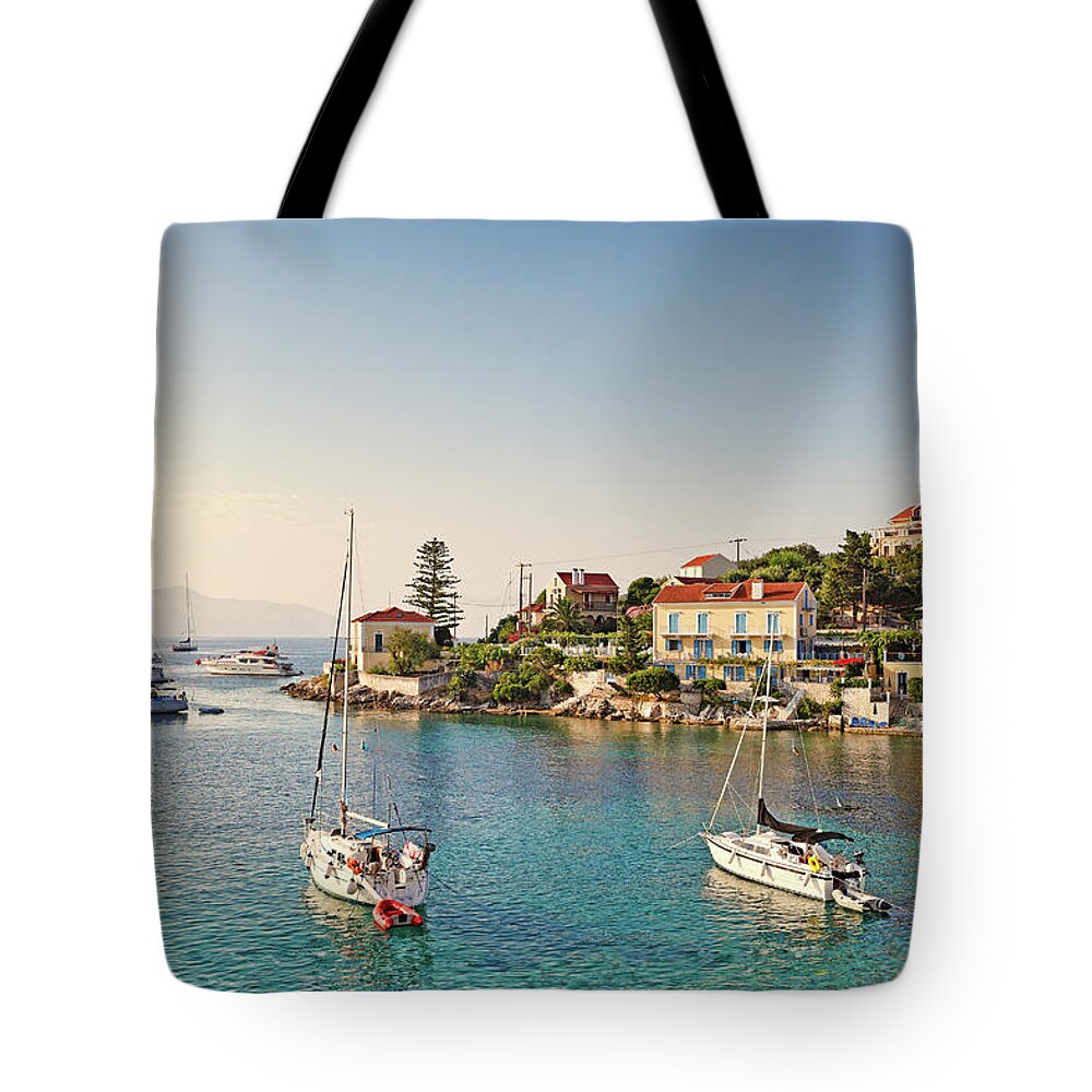 Fiscardo Tote Bag featuring the photograph The port of Fiskardo in Kefalonia, Greece #2 by Constantinos Iliopoulos