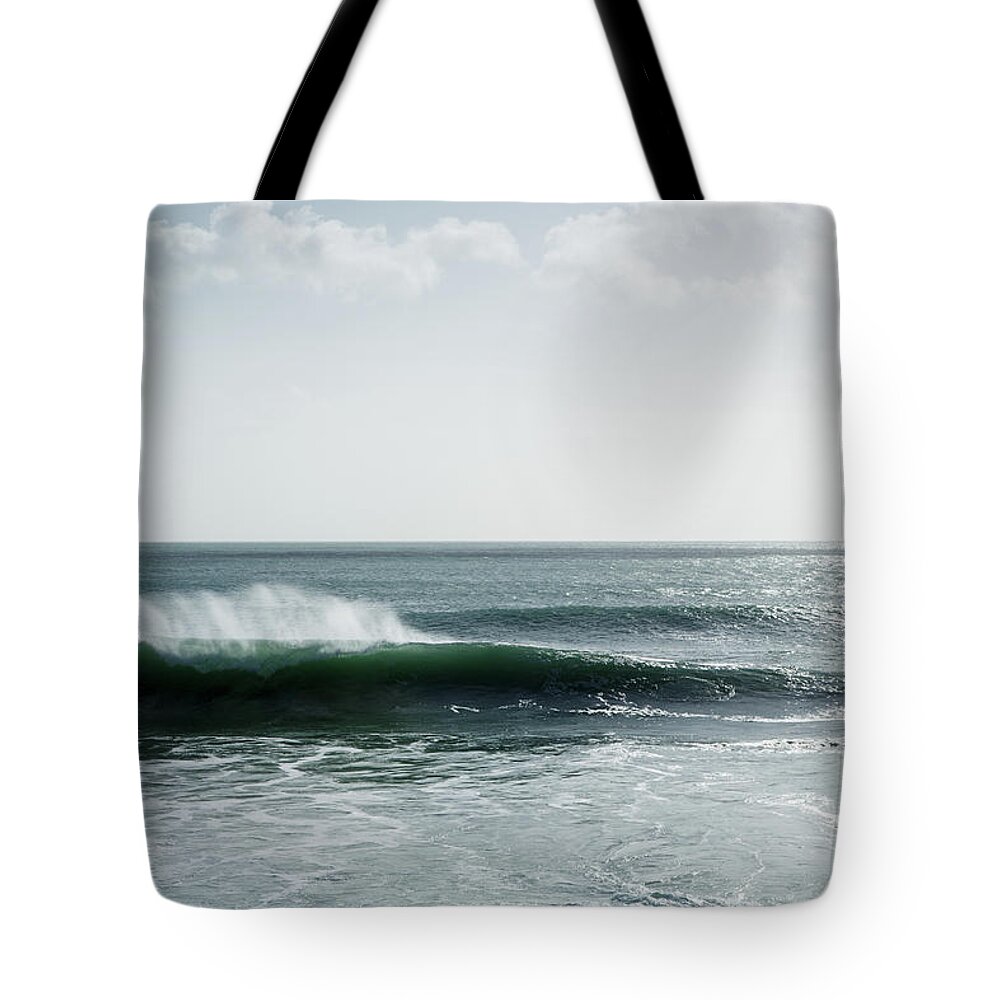 Porthleven Tote Bag featuring the photograph Waves crashing at Porthleven Beach #2 by Ian Middleton
