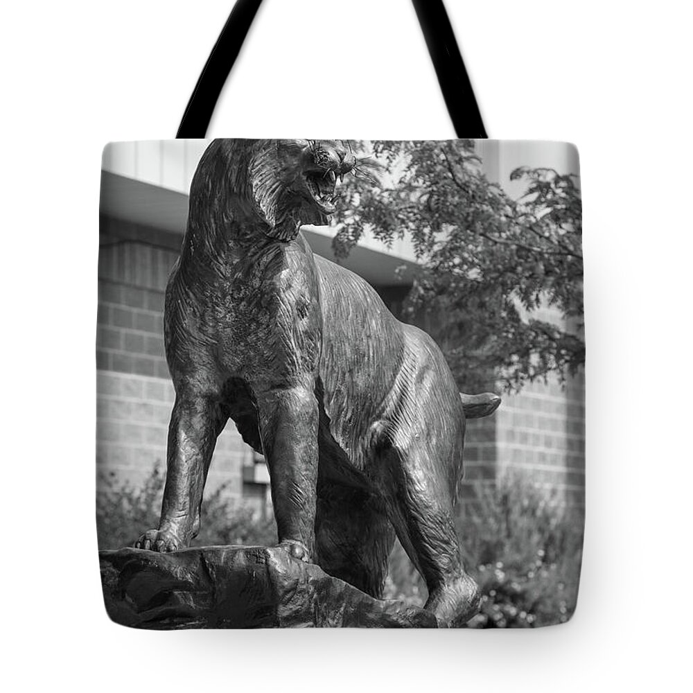Montana State University Tote Bag featuring the photograph Montana State University Bobcat statue in black and white #4 by Eldon McGraw