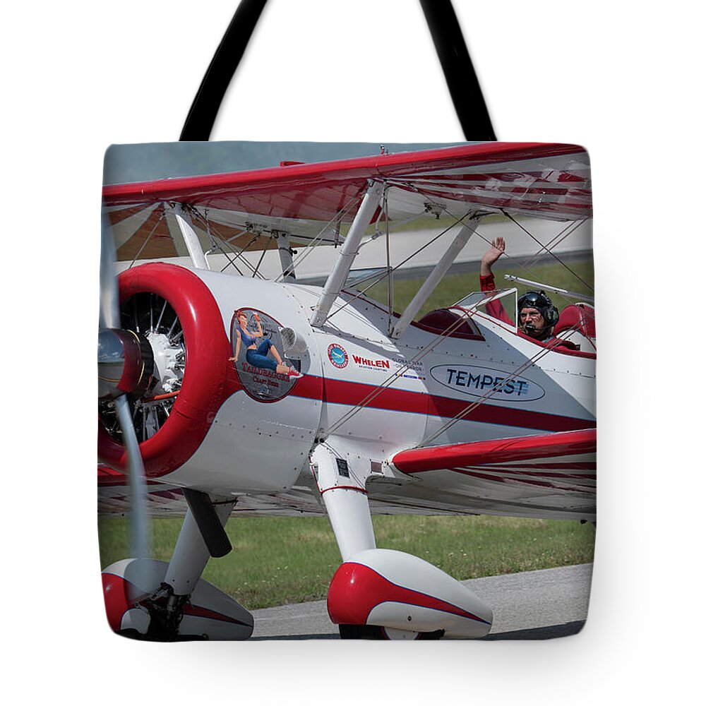 Red Tote Bag featuring the photograph Red and White Airplane by Carolyn Hutchins