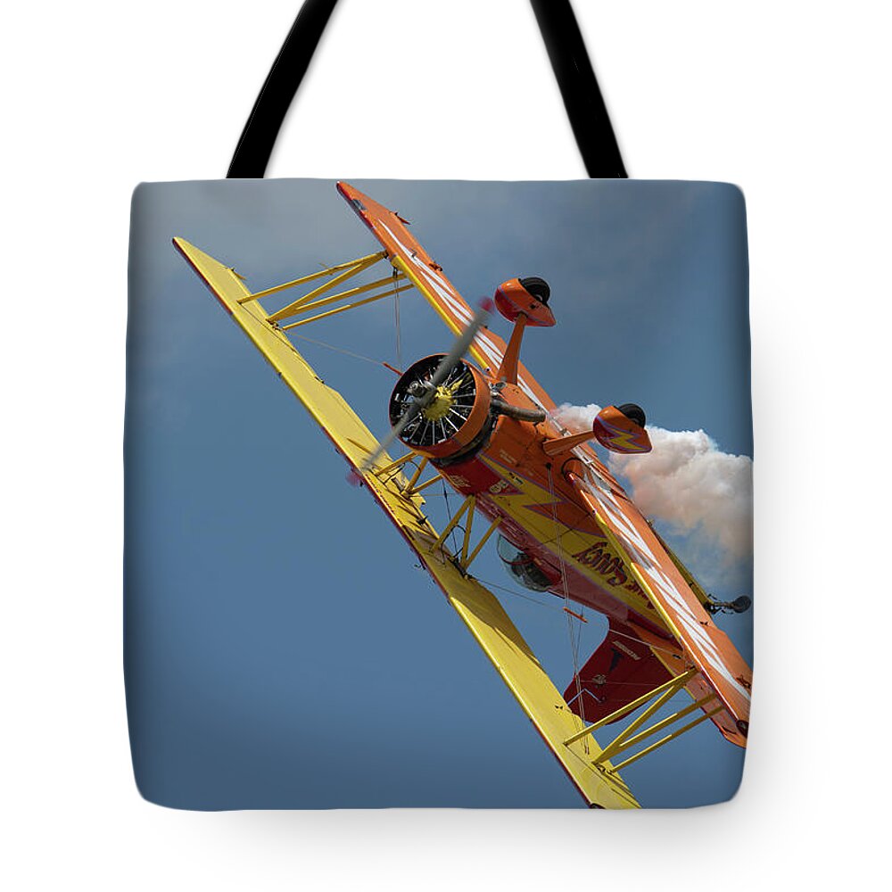 Red Tote Bag featuring the photograph Red and Yellow Airplane #8 by Carolyn Hutchins