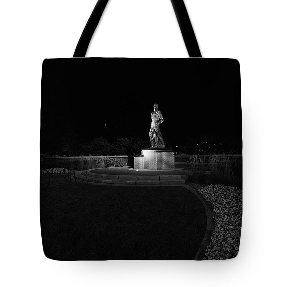 Spartan Staue Night Tote Bag featuring the photograph Spartan statue at night on the campus of Michigan State University in East Lansing Michigan #7 by Eldon McGraw
