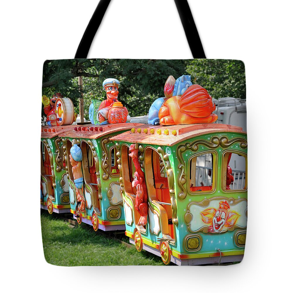 Child's Play Tote Bag featuring the photograph A Child's Delight by Sarah McKoy