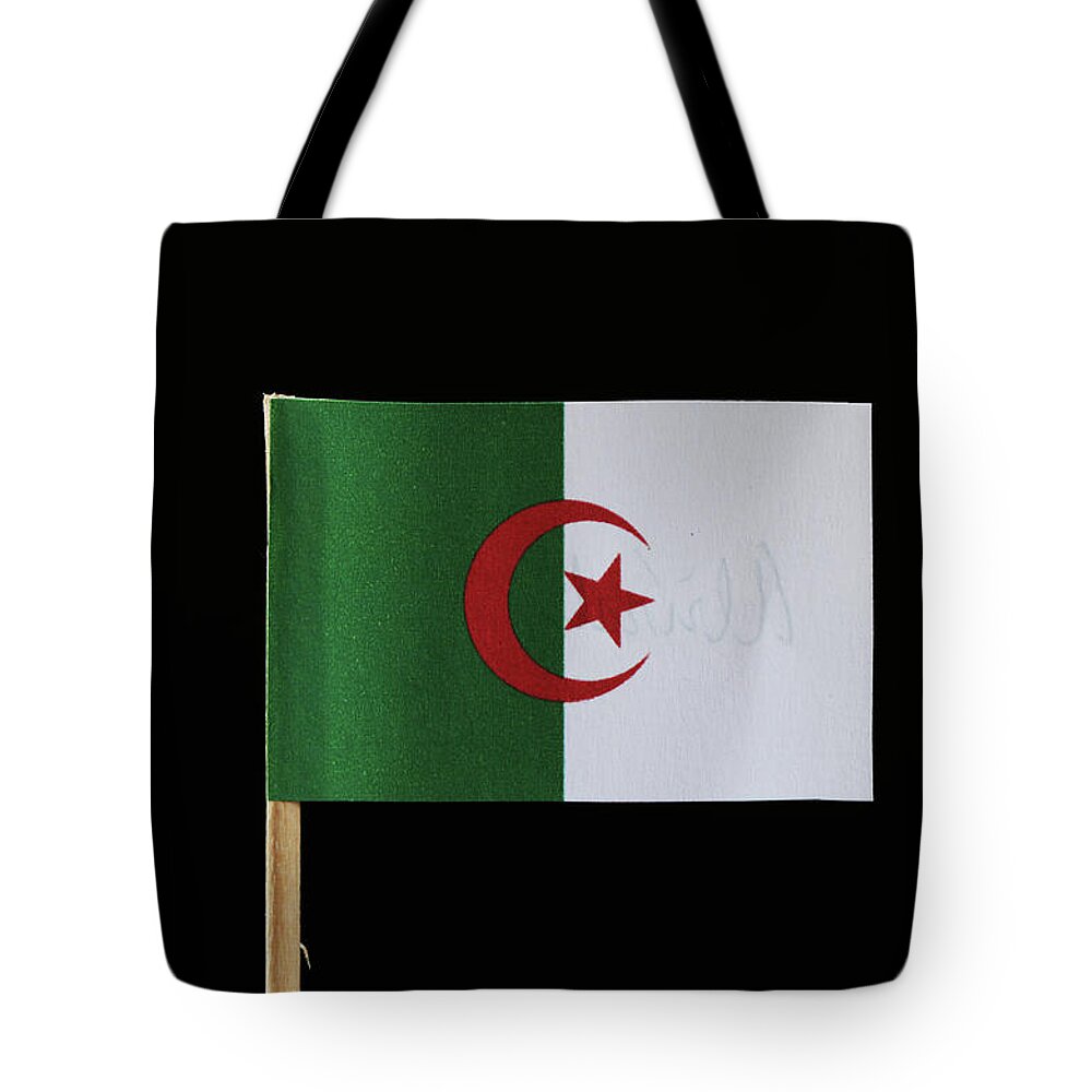 Algeria Tote Bag featuring the photograph A original and official flag of Algeria on toothpick on black background. Consists of two equal vertical bars, green and white with a red star and crescent by Vaclav Sonnek