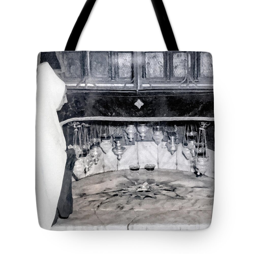 Nativity Tote Bag featuring the photograph A Prayer at Nativity Grotto by Munir Alawi