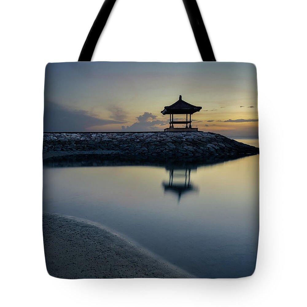 Asia Tote Bag featuring the photograph A quiet and still morning at Karang beach in Sanur by Anges Van der Logt