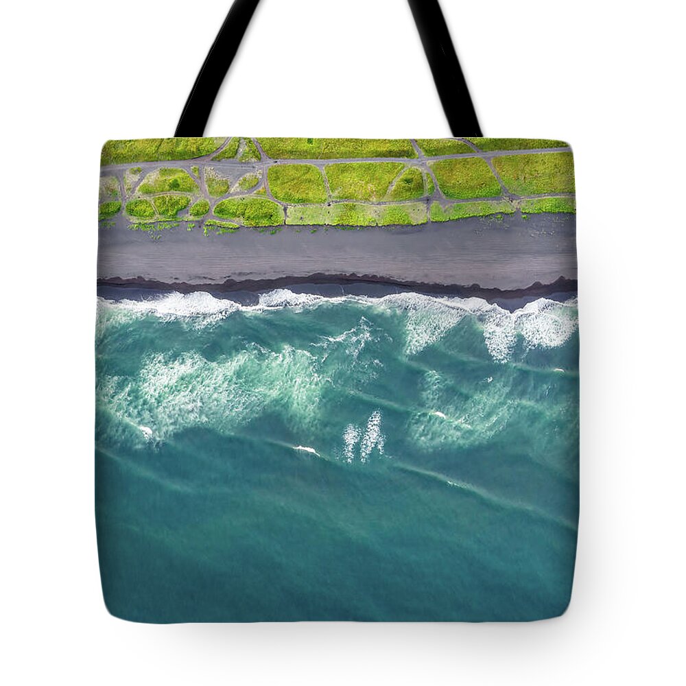 Beach Tote Bag featuring the photograph Aerial top view of beach with black sand by Mikhail Kokhanchikov