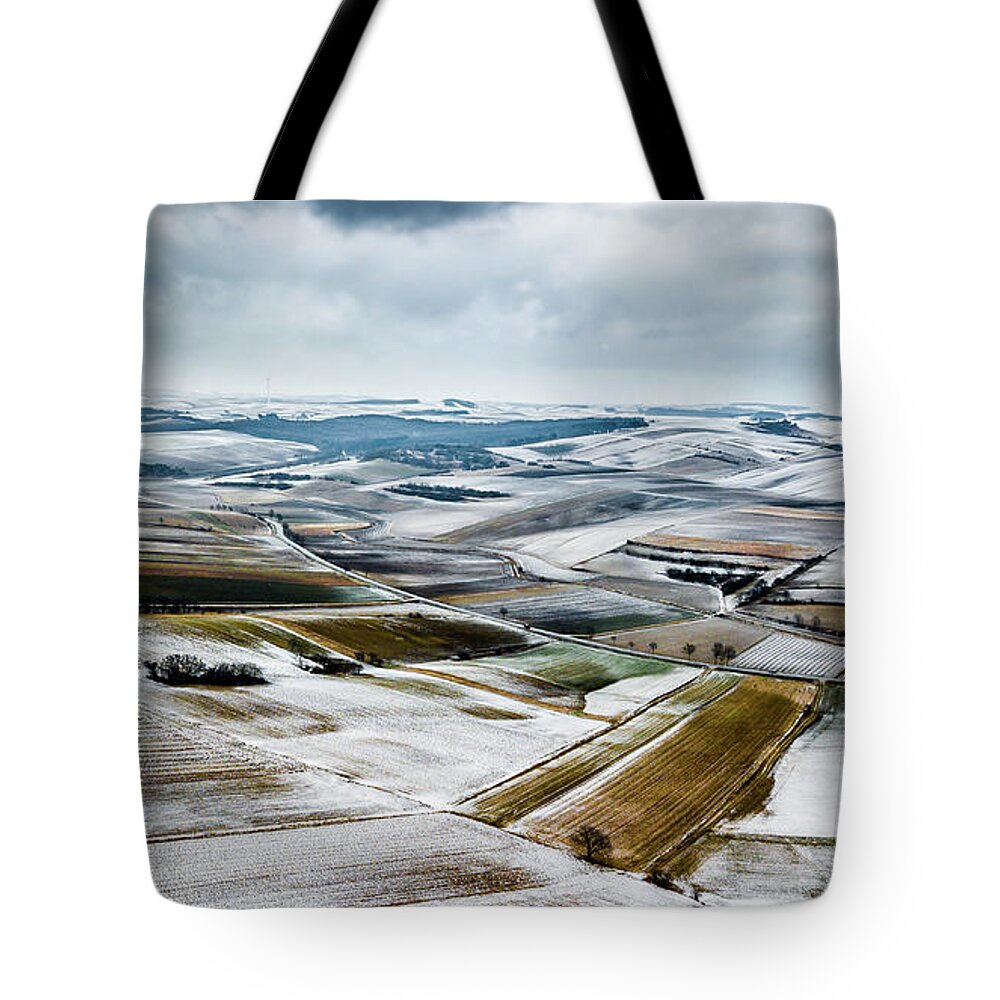 Above Tote Bag featuring the photograph Aerial View Of Winter Landscape With Remote Settlements And Snow Covered Fields In Austria by Andreas Berthold