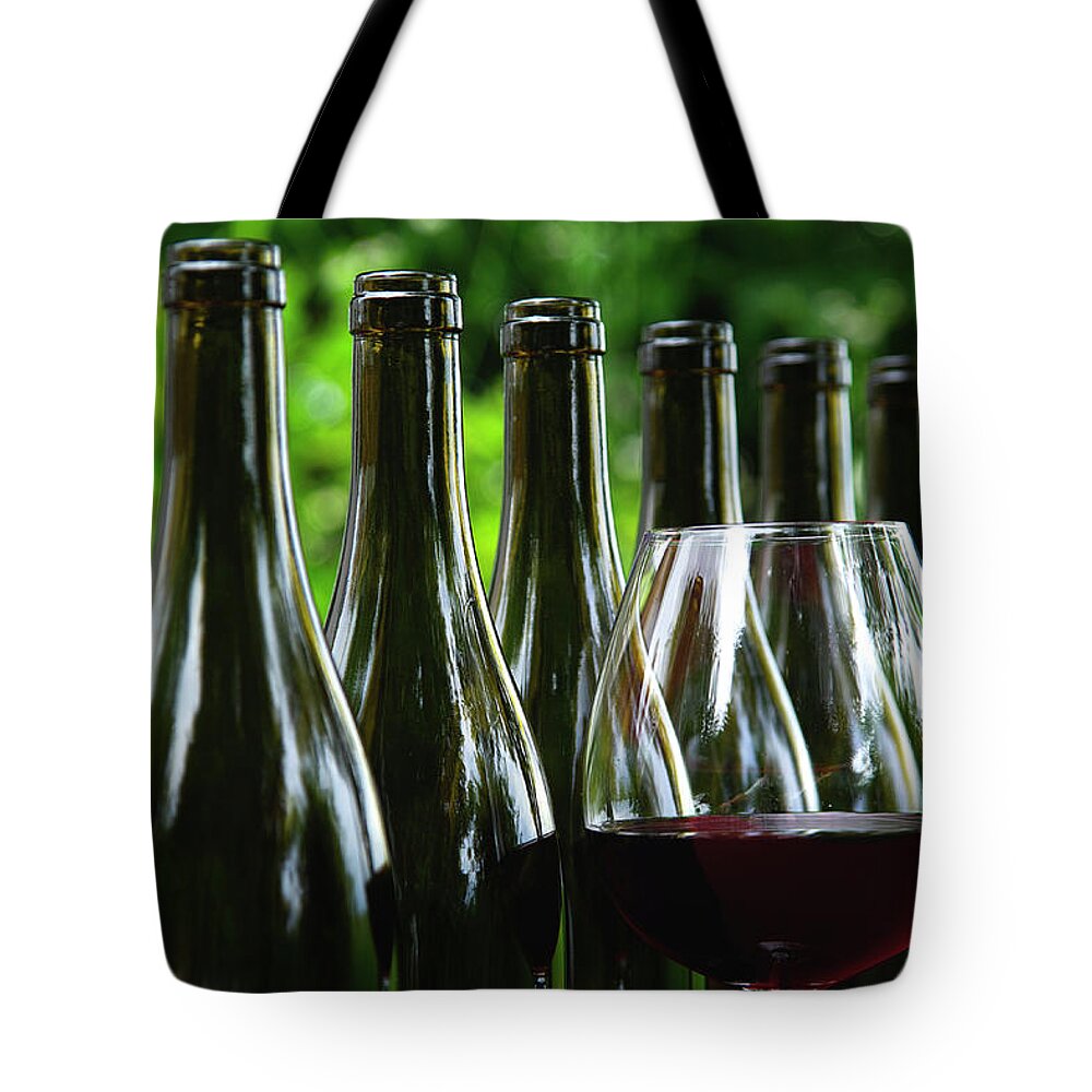 Wine Tote Bag featuring the photograph Wine Bottles All In a Row by Kenneth Lane Smith