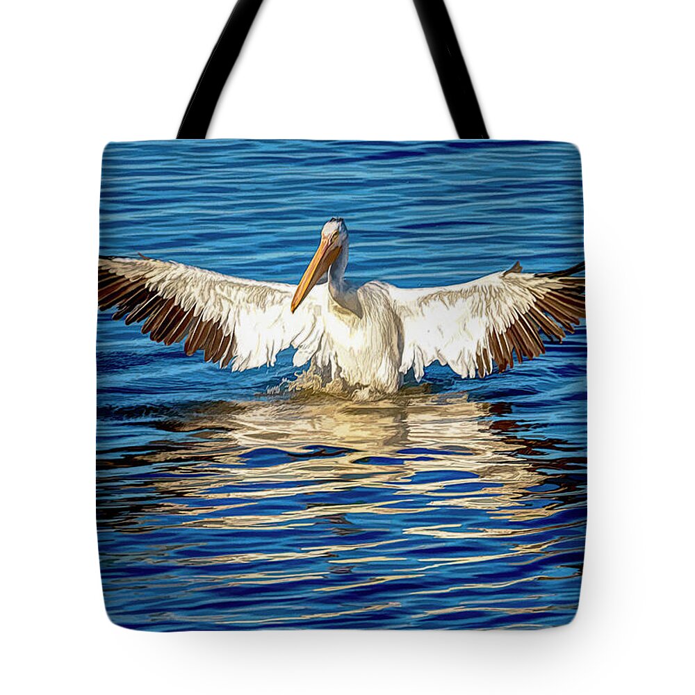 American White Pelican Tote Bag featuring the photograph Arriving A Bit Weathered and Worn by Debra Martz