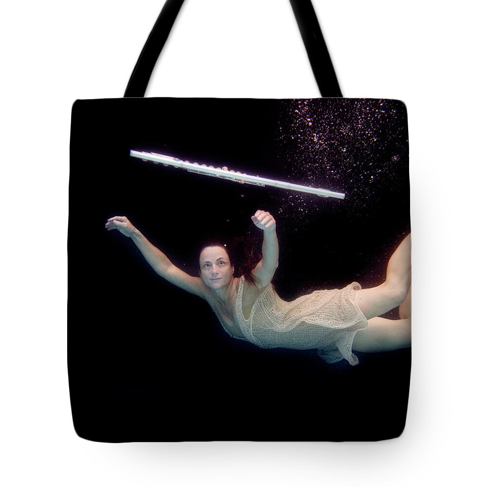 Artist Tote Bag featuring the photograph Artist magically floating with her flute 61 by Dan Friend