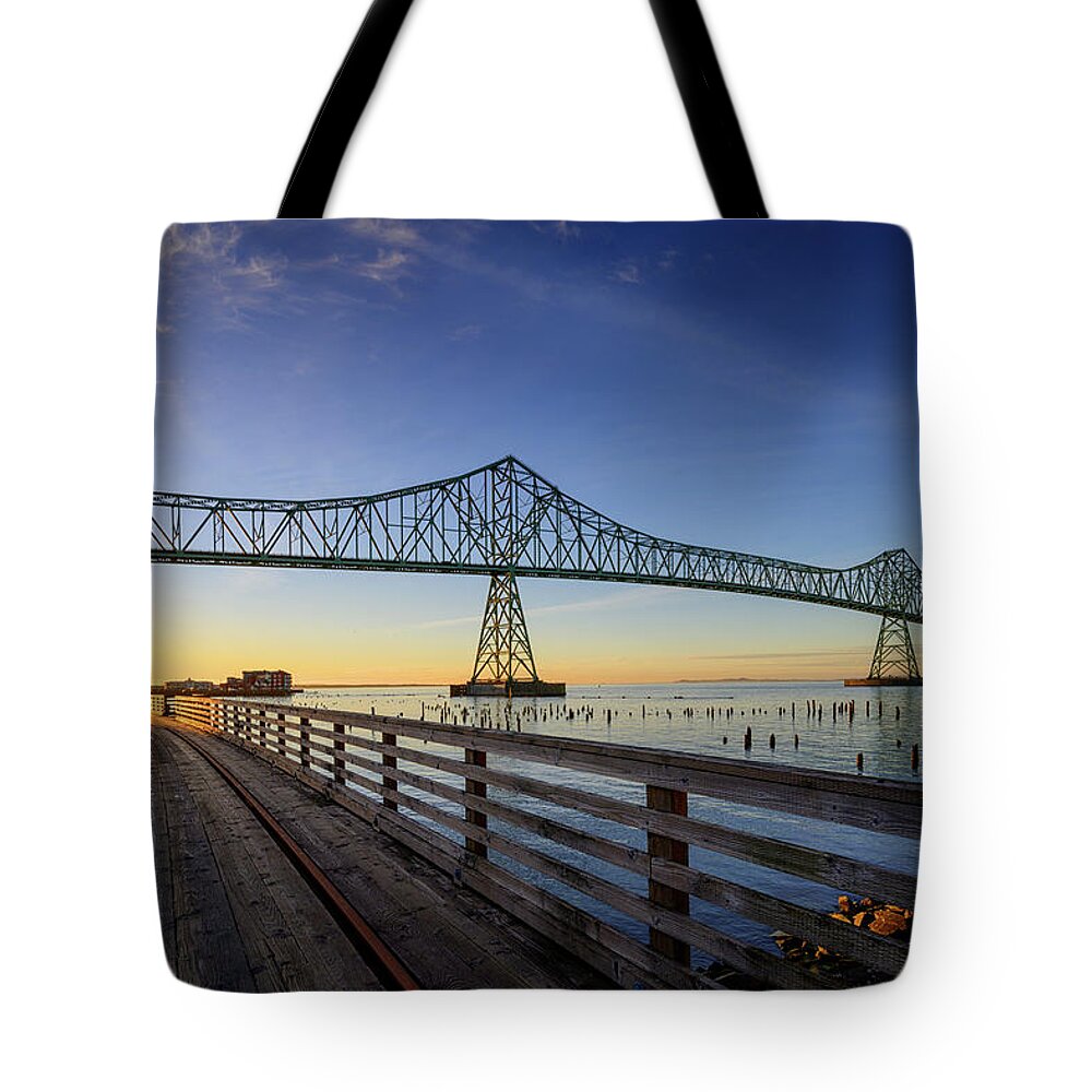 Astoria Tote Bag featuring the photograph Astoria Riverwalk Trestle by Dan Mihai