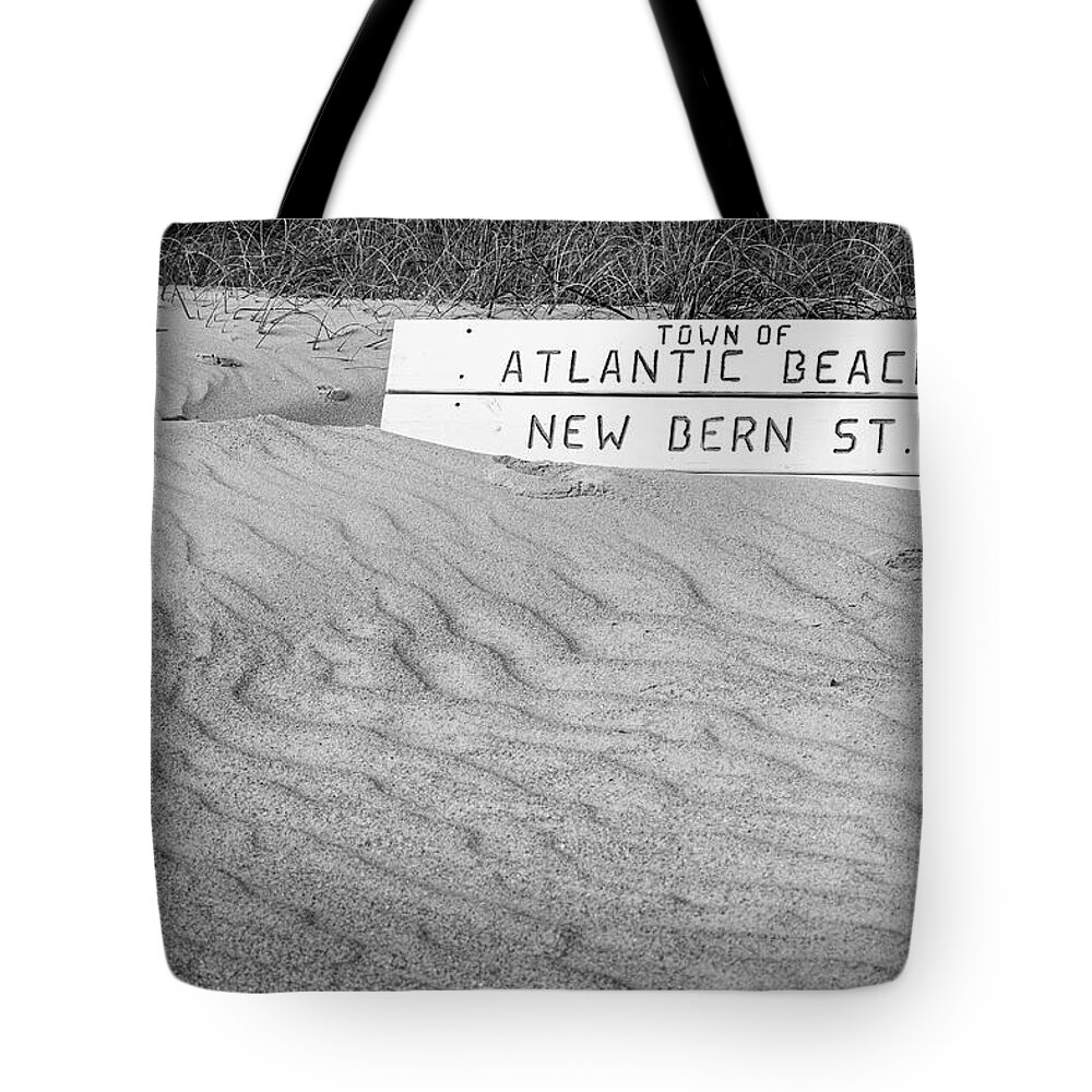 Atlantic Beach Tote Bag featuring the photograph Atlantic Beach Bench Partially Covered by Bob Decker