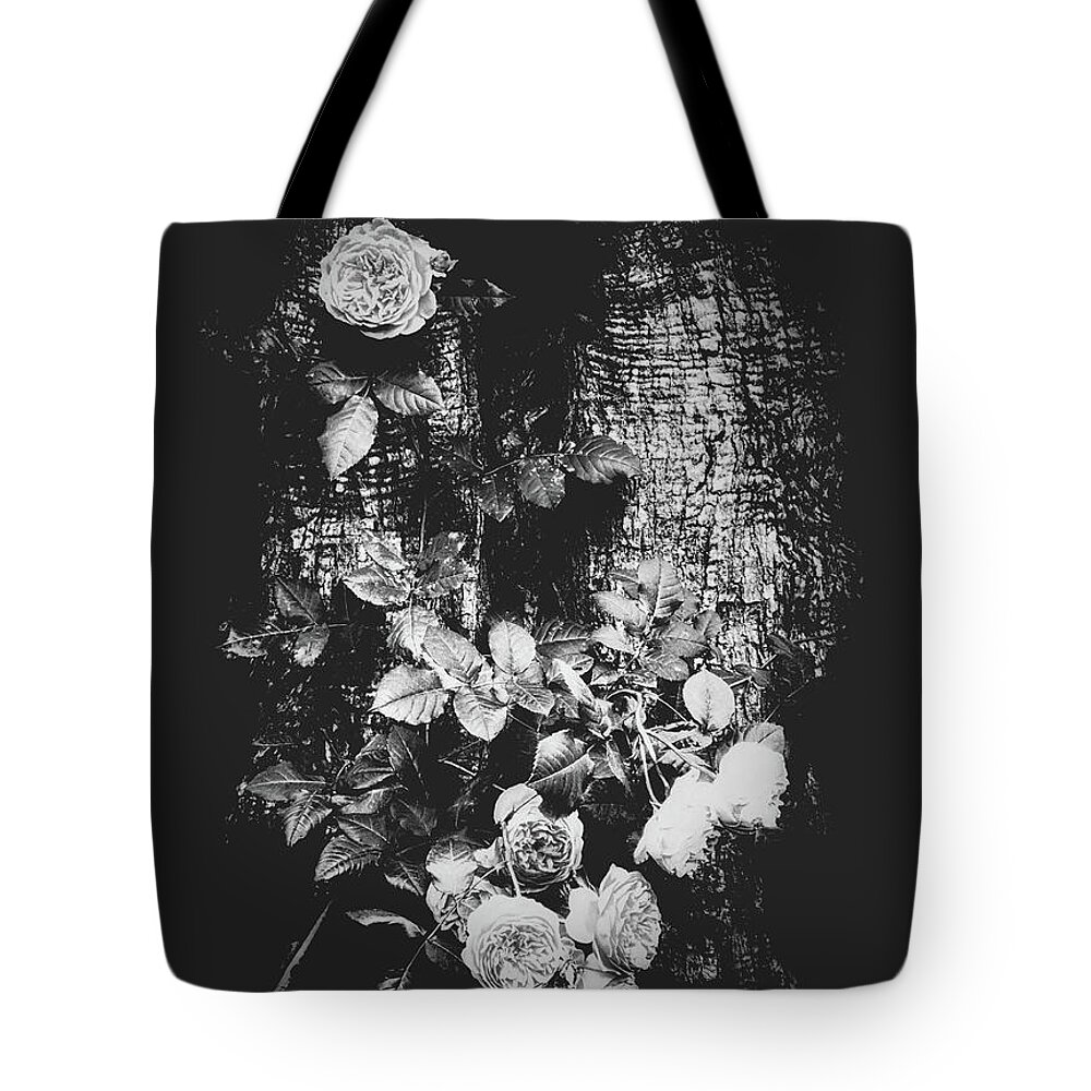 Roses Tote Bag featuring the photograph Attached by Wim Lanclus