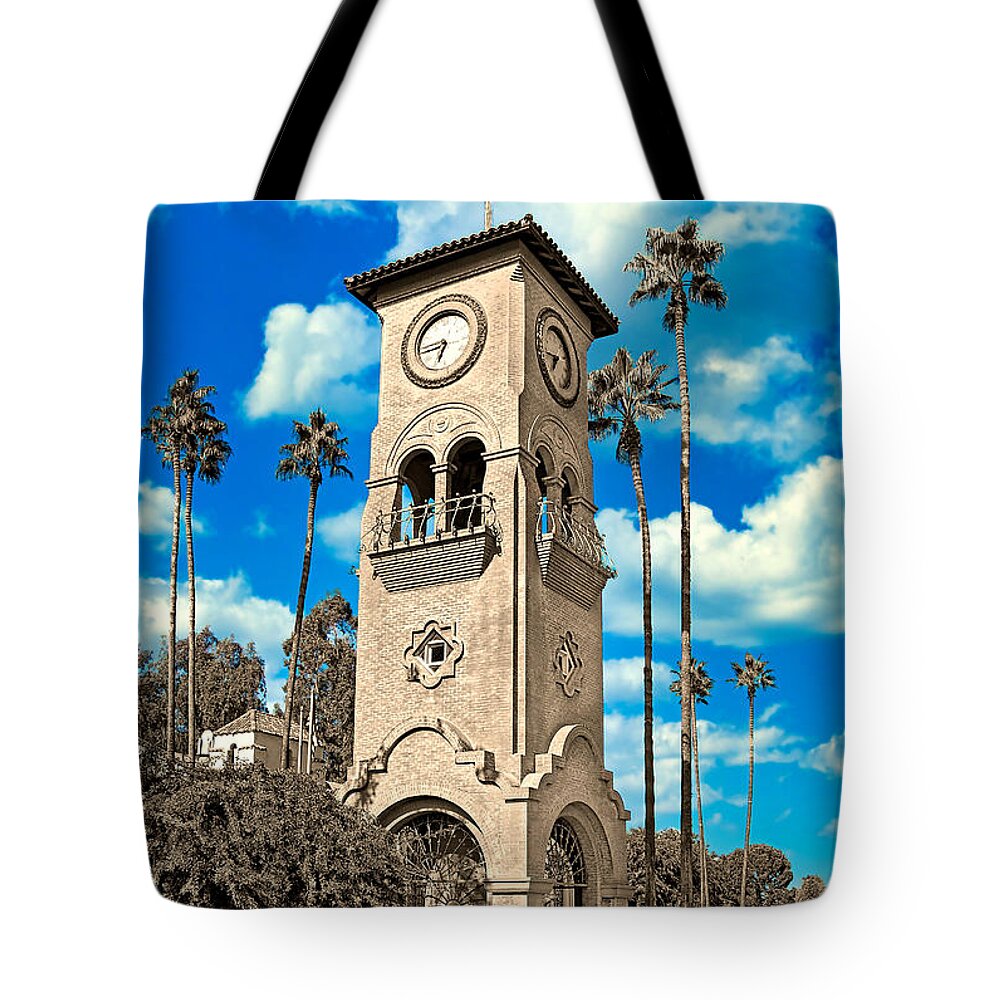 Beale Memorial Clock Tower Tote Bag featuring the digital art Beale Memorial Clock Tower in Bakersfield, California - black and white, with the blue sky isolated by Nicko Prints