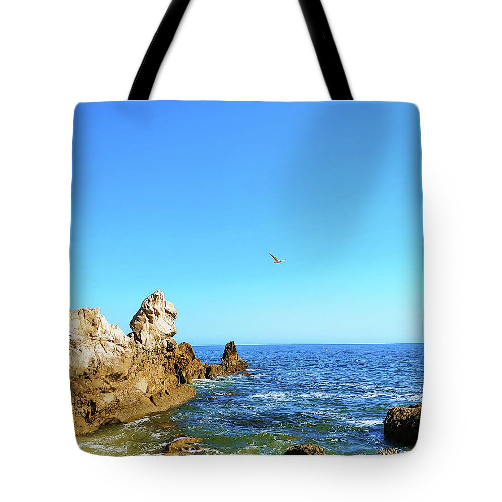 Ocean Tote Bag featuring the photograph Bird in the Sky at the Beach by Marcus Jones