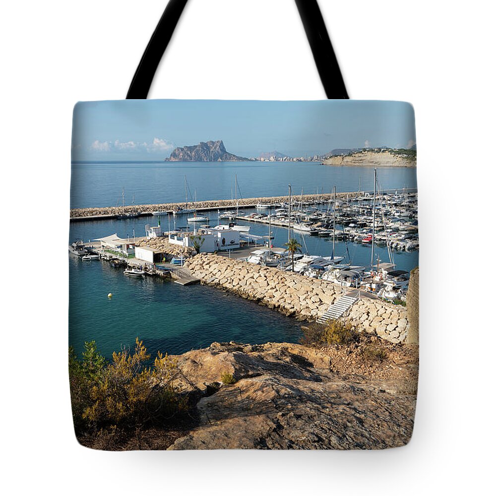 Mediterranean Coast Tote Bag featuring the photograph Blue Mediterranean Sea and marina in Moraira 1 by Adriana Mueller