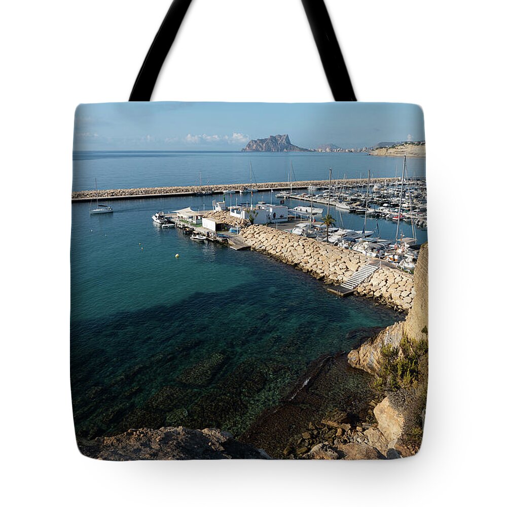 Mediterranean Coast Tote Bag featuring the photograph Blue Mediterranean Sea and marina in Moraira 2 by Adriana Mueller